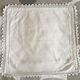 A handmade lace cushion cover