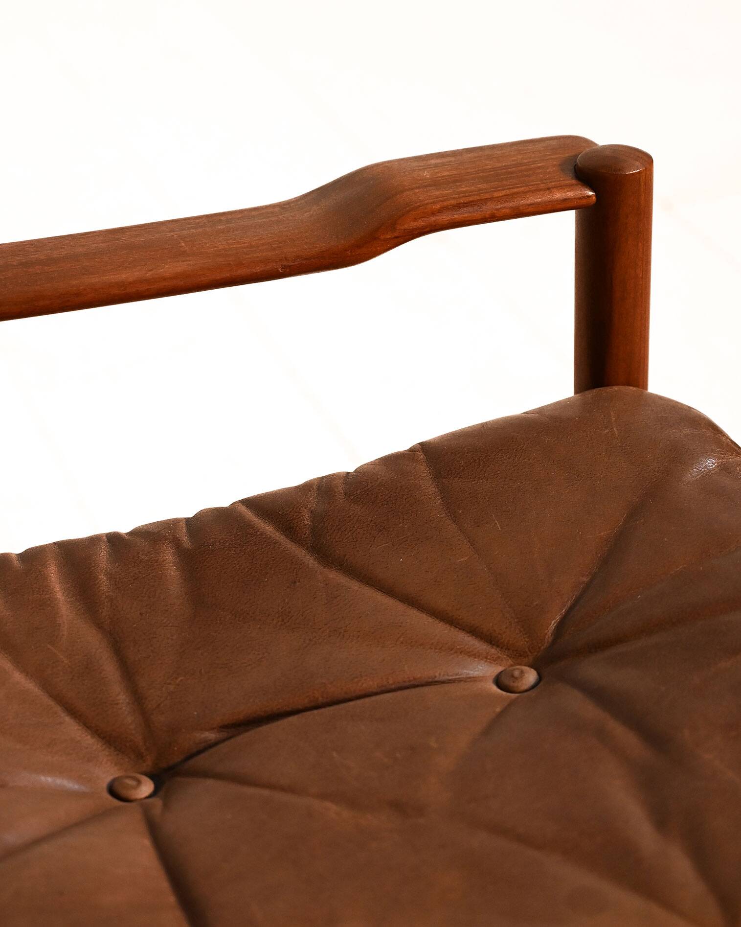Scandinavian teak and leather lounge set with two armchairs and ottoman