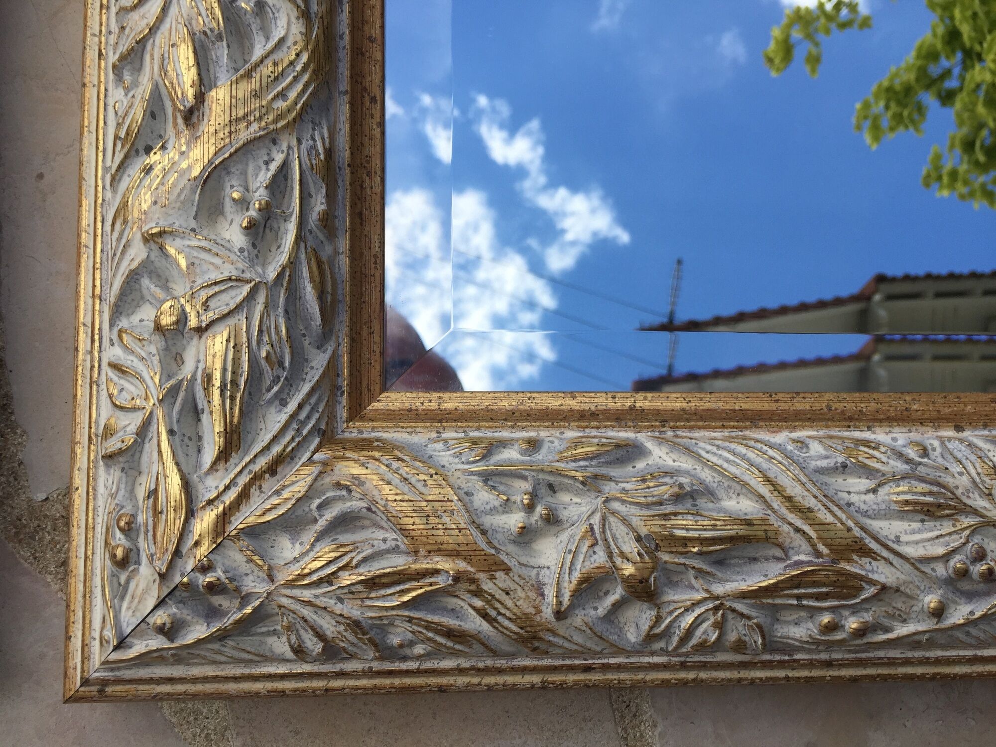 Pair of bevelled mirrors in white and gilded wood 86 x 66 cm