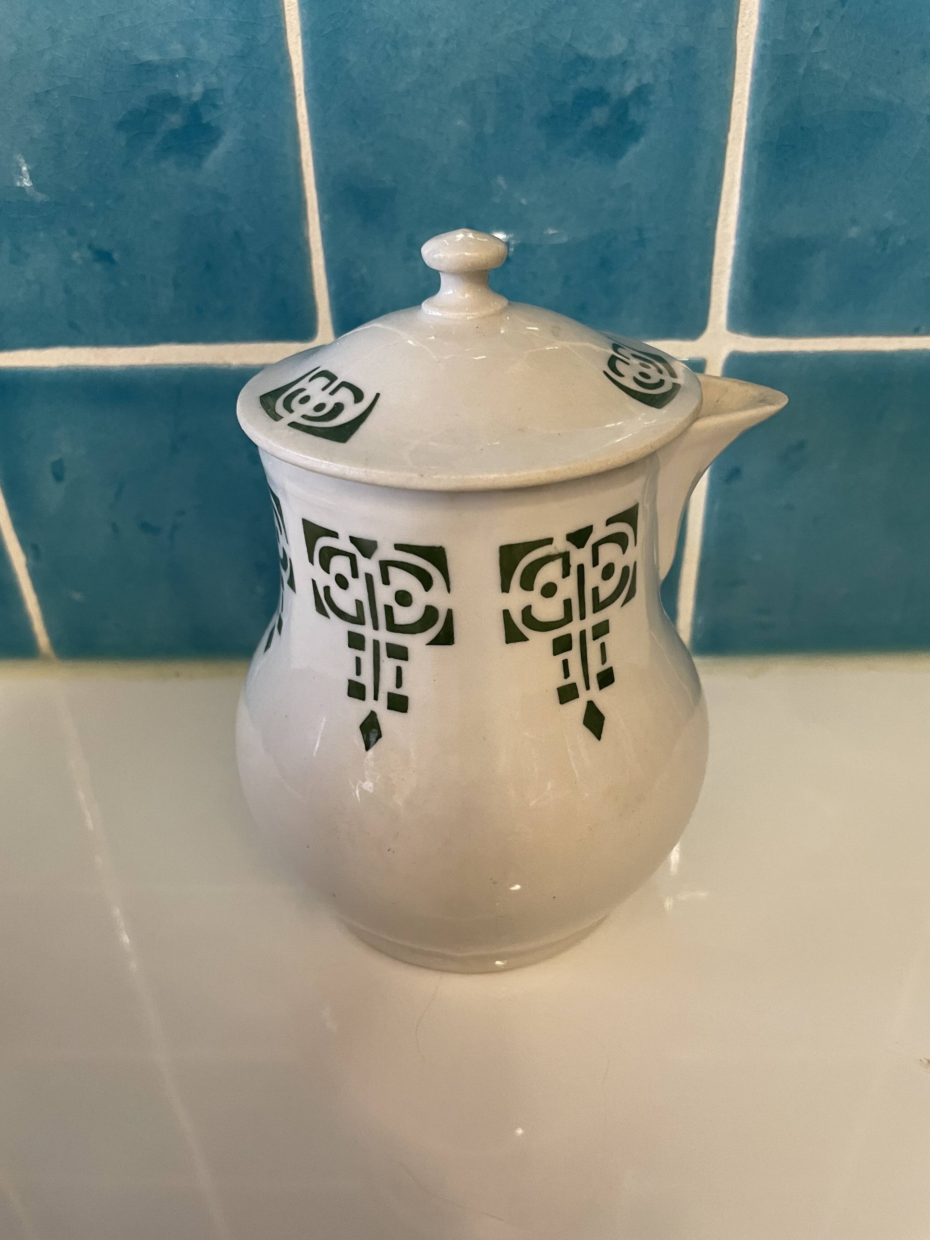 Set of 4 vintage art deco Saint Uze pitchers