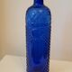 Vintage decanter bottle made of blue molded pressed glass