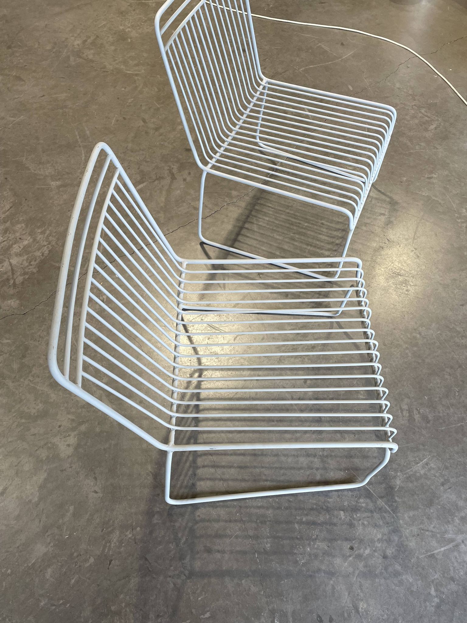 Many handcrafted wrought iron chairs