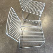 Many handcrafted wrought iron chairs