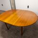 Scandinavian table in round teak with built-in extensions 1960