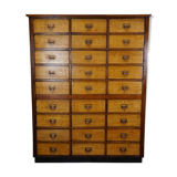 School cabinet bank of vintage Dutch drawers in mid-twentieth century pine