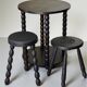 Set of side table and 2 stools, stained black wood, Circa 1950.