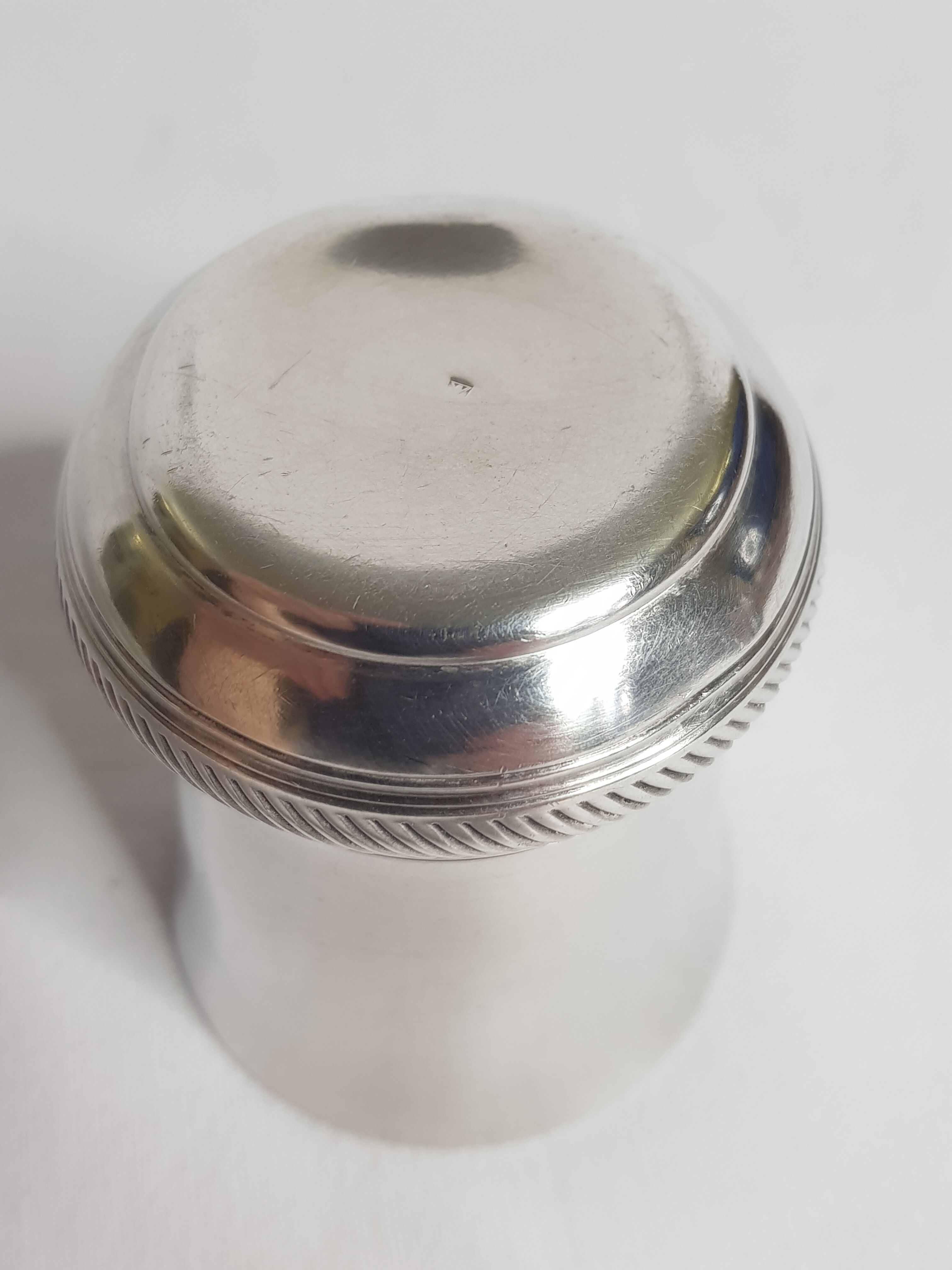 Old silver metal timbale with punch