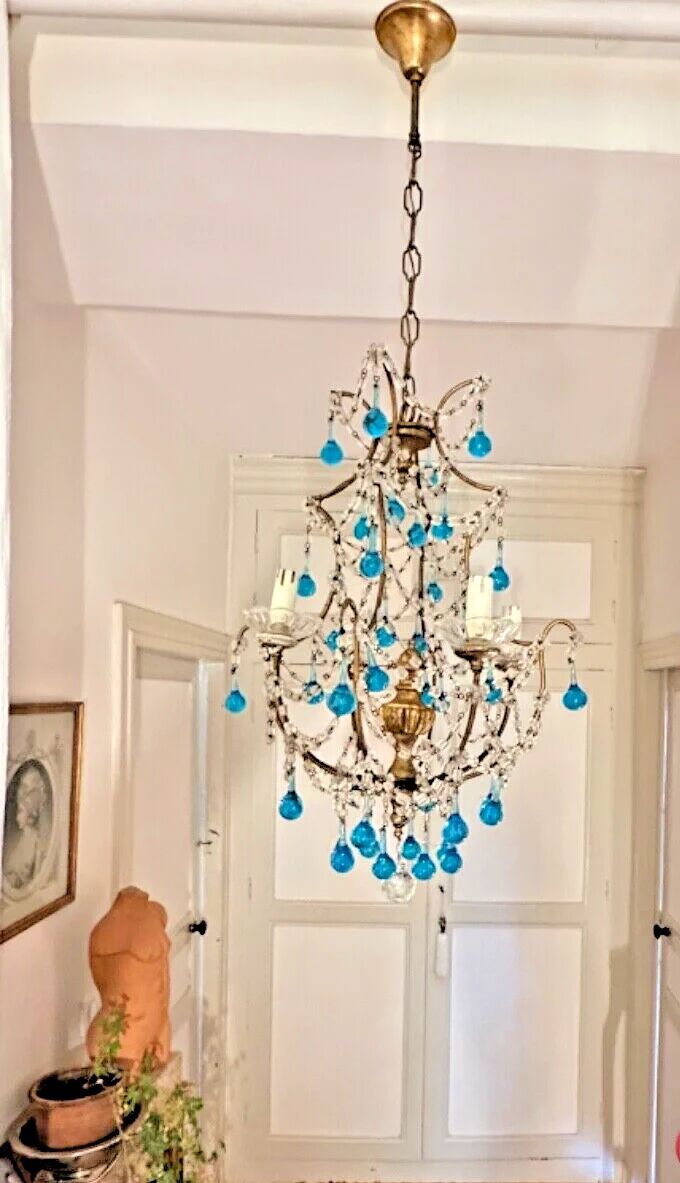 Italian chandelier with blue beads and gilded wood.