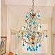 Italian chandelier with blue beads and gilded wood.