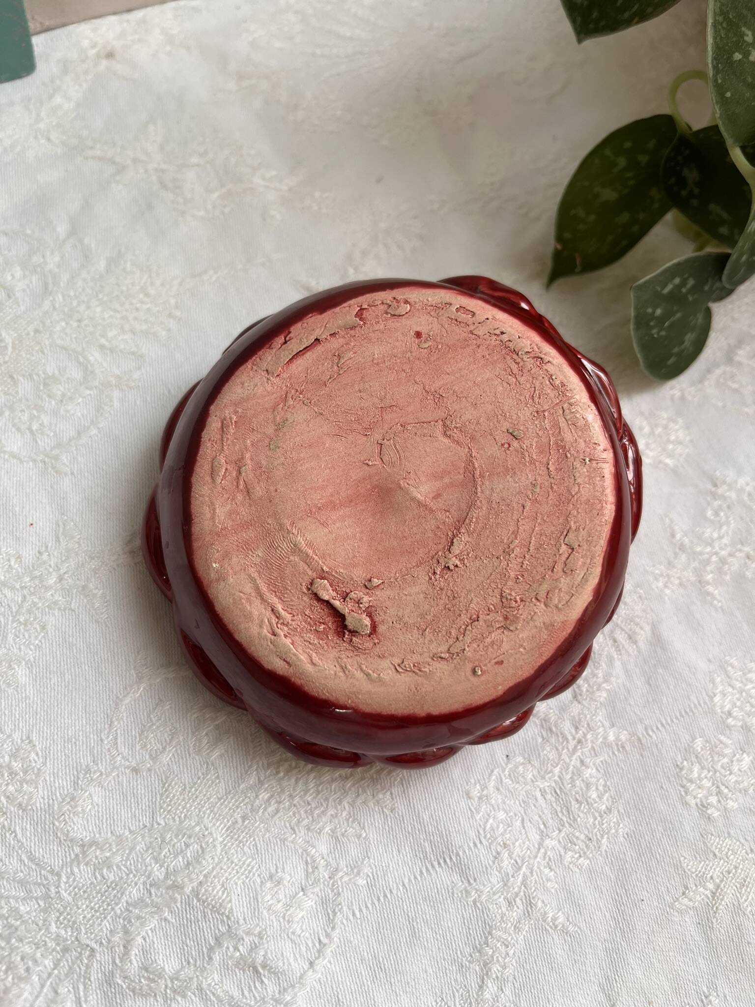 Twisted red earthenware candle holder - in the style of St Clément