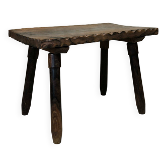 Small vintage coffee table made of solid wood.