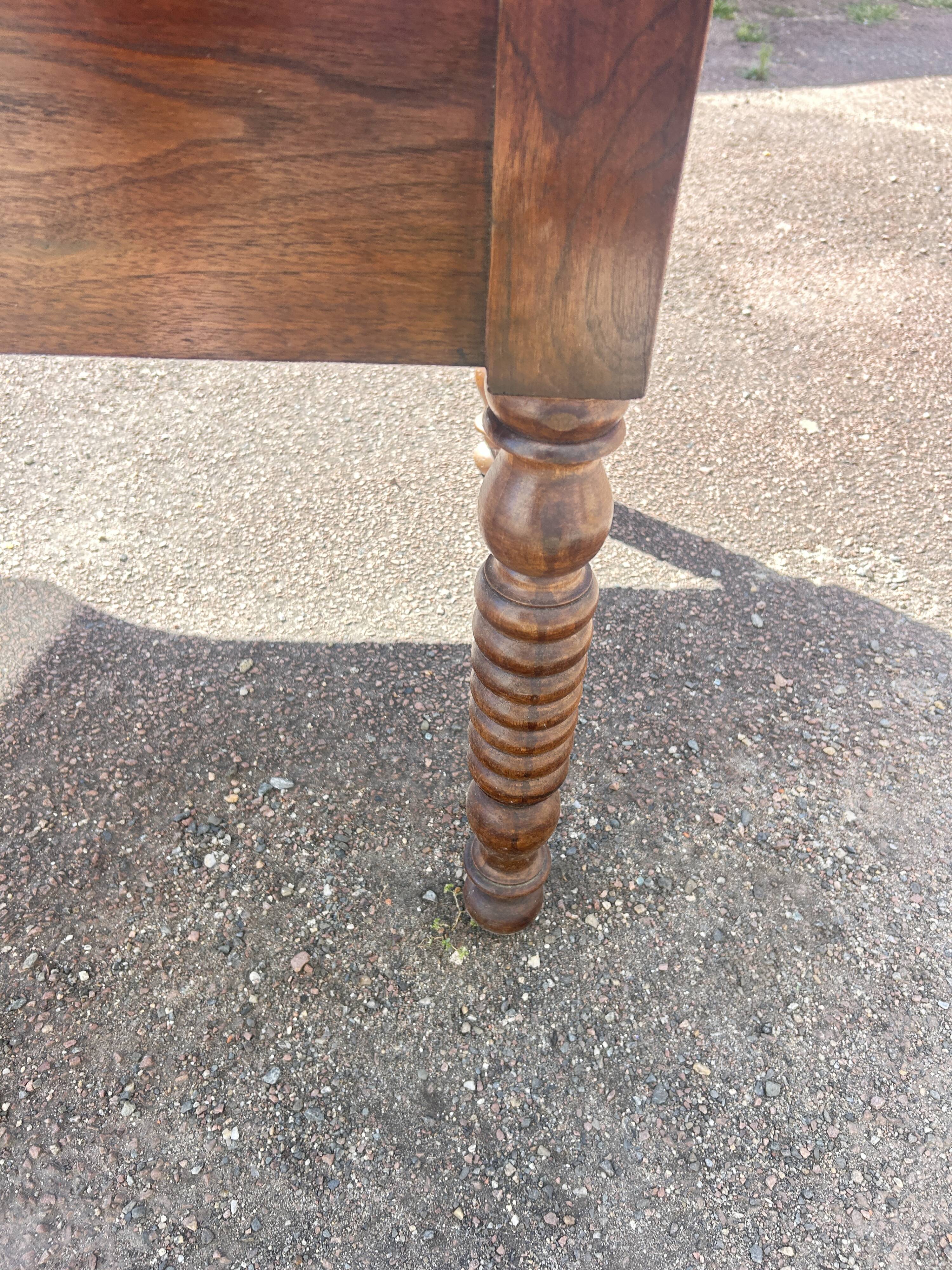 Louis Philippe desk in walnut, with a leather top.