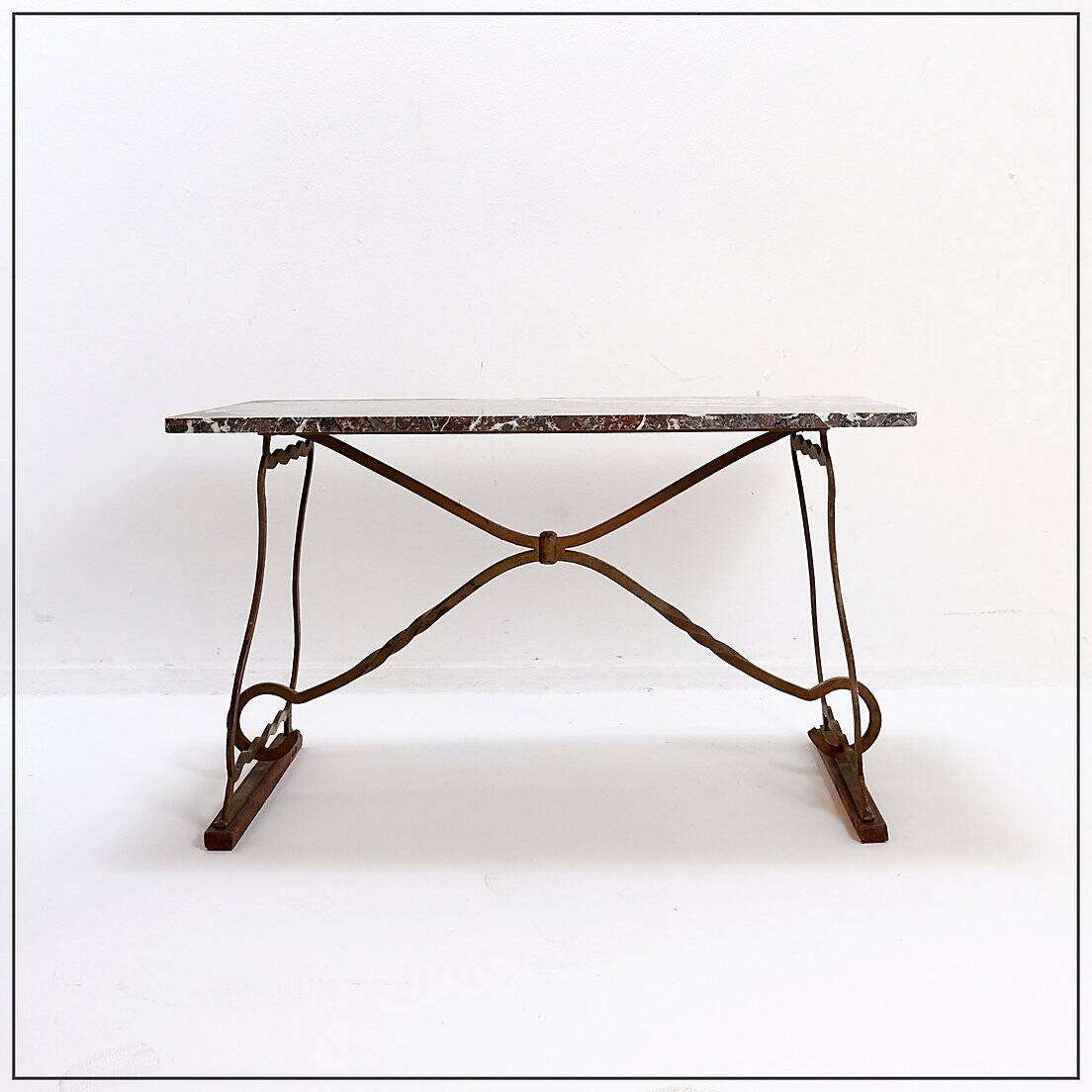Wrought iron and marble coffee table