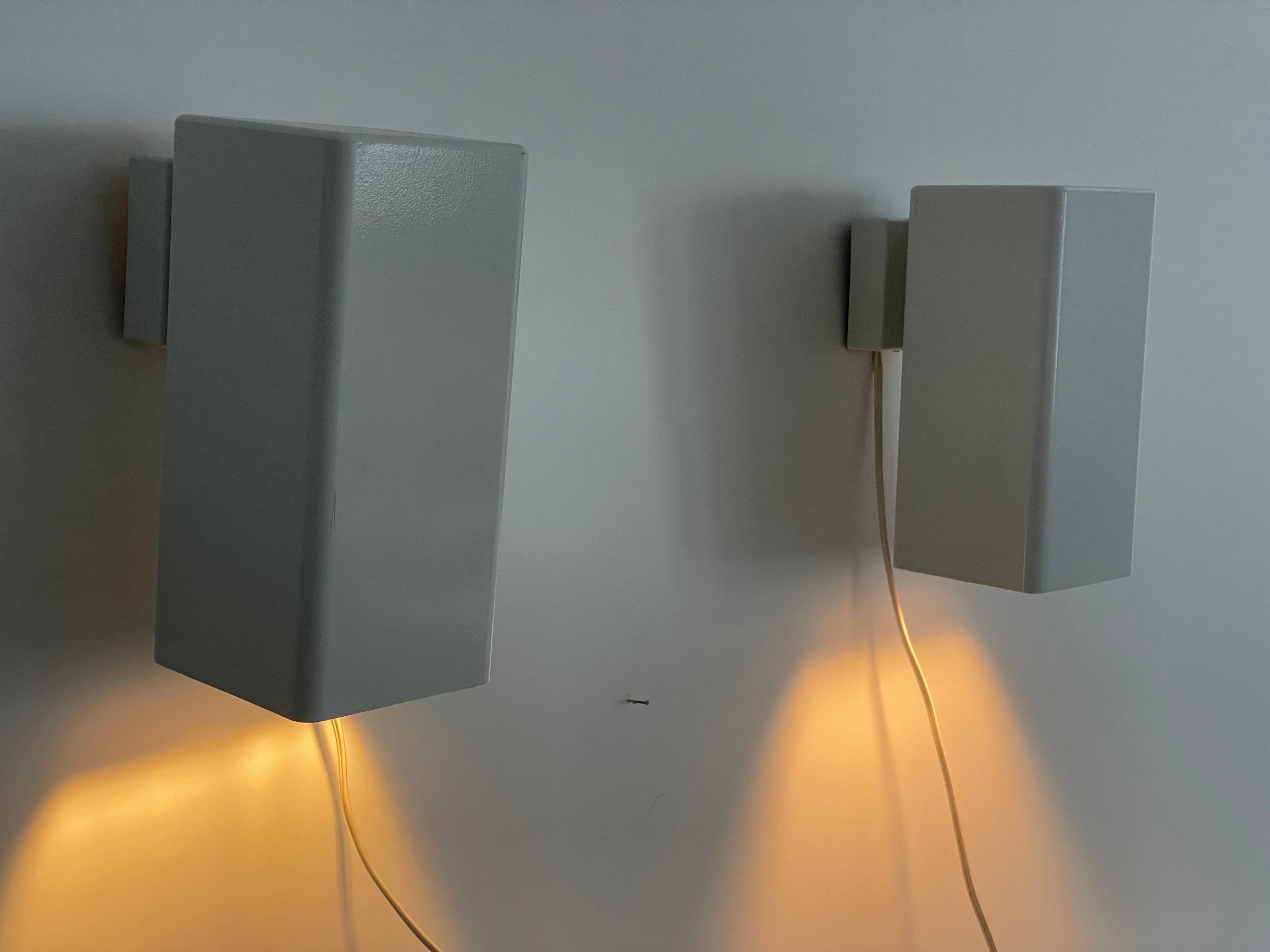 Pair of minimalist white metal wall lights from the mid-century, 1960, Germany.