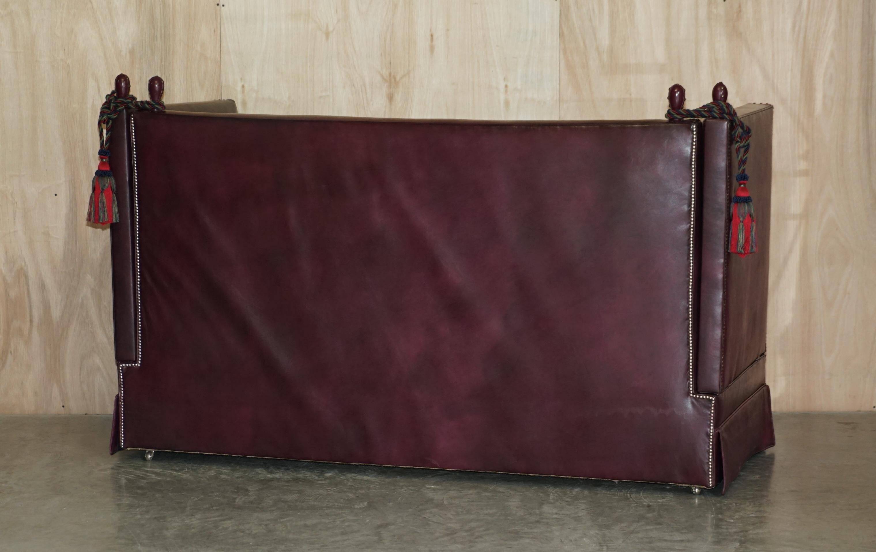 Victorian Knole canapé restored in leather with feather cushions.