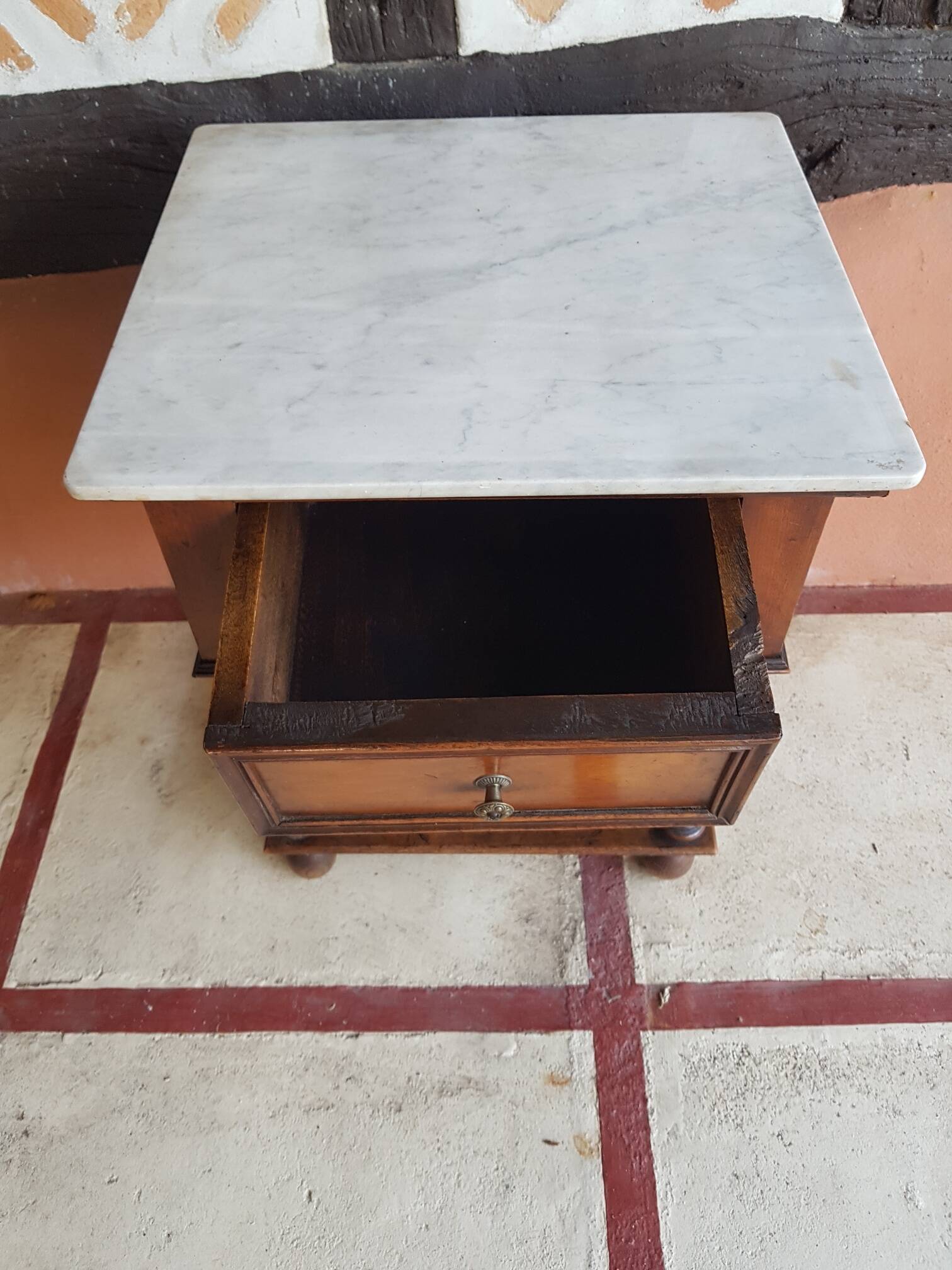 Old wooden marble bedside table