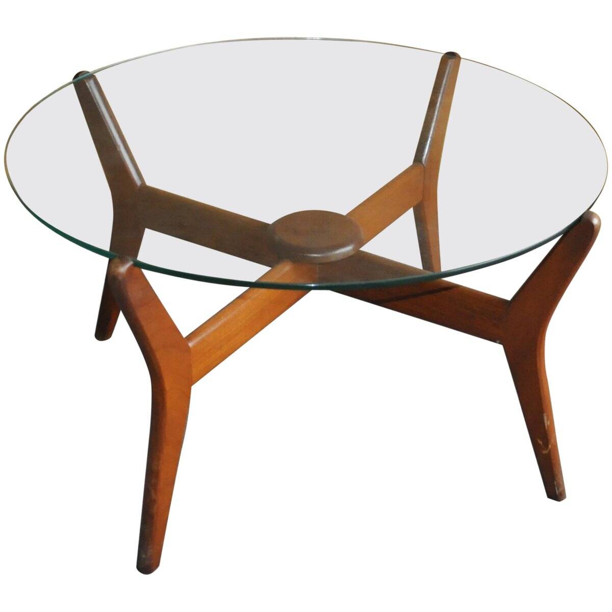 Mid-century coffee table in brown teak with a floating tempered glass top.