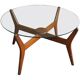 Mid-century coffee table in brown teak with a floating tempered glass top.