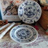 Old plates with blue floral decoration.
