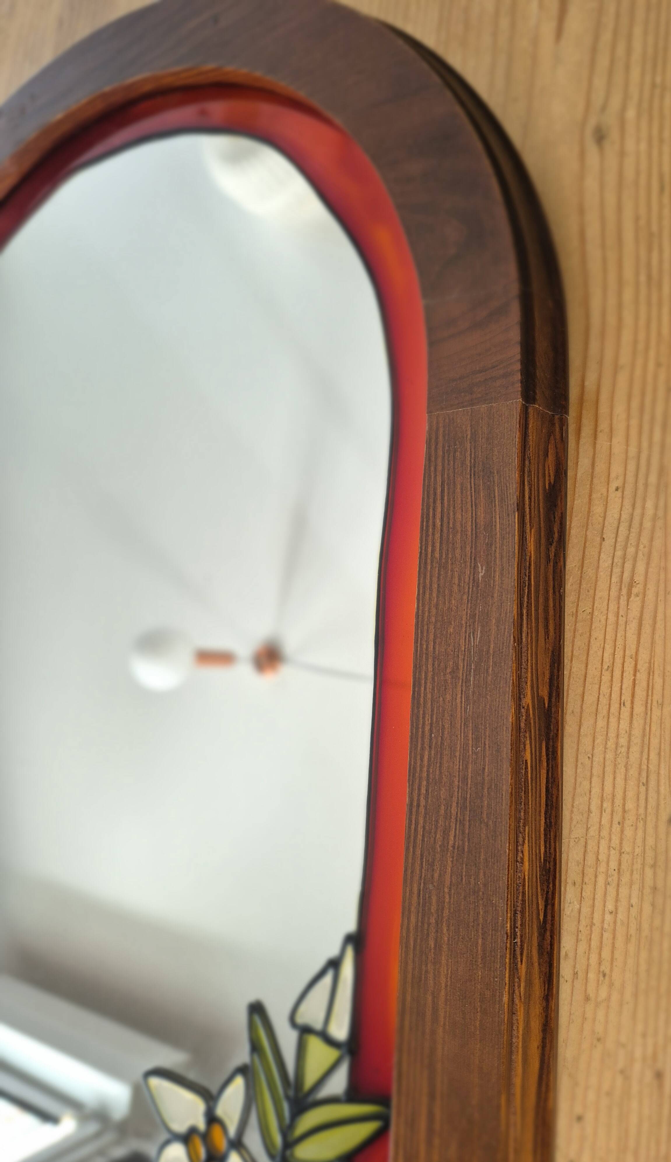 A pair of vintage stained glass style mirrors.