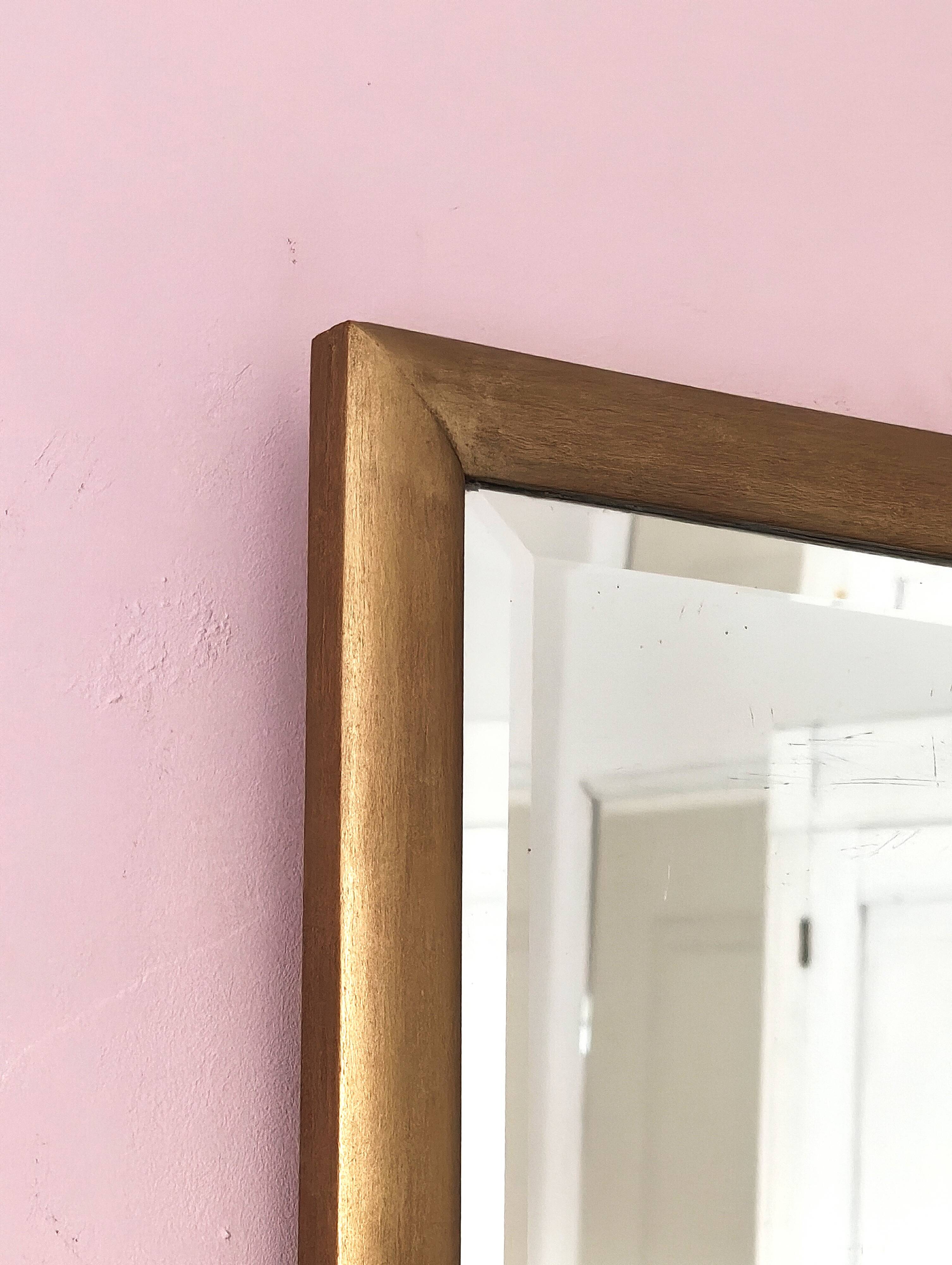 Petit miroir ancien en bois doré et glace biseautée