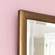 Petit miroir ancien en bois doré et glace biseautée