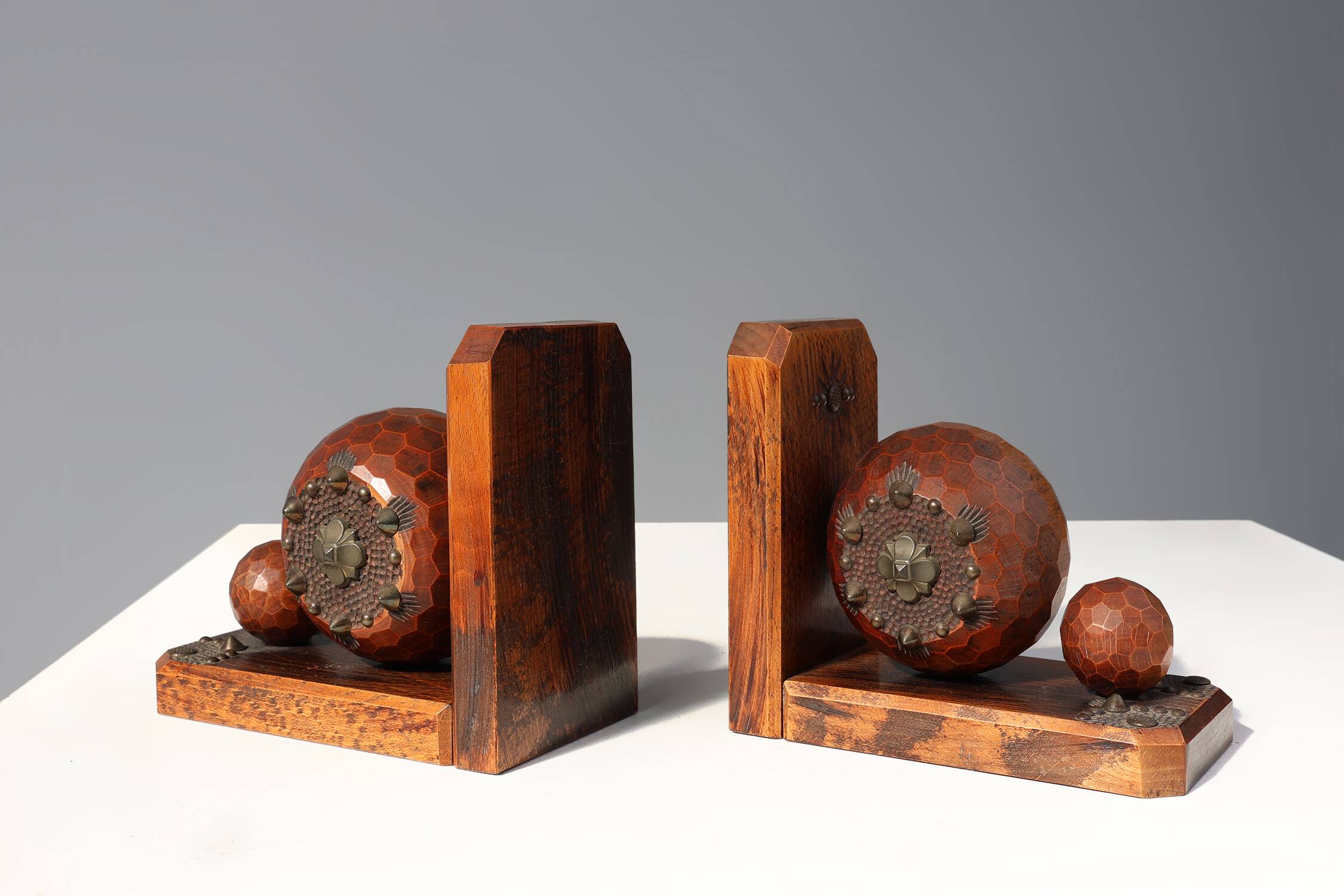 Pair of Art Deco faceted ball bookends in oak with metal decorations