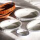 Set of 4 white porcelain dishes with blue decorations and wicker stands