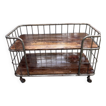 Industrial metal and wood serving trolley on wheels