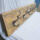 Teak coat rack with 10 double cast iron hooks