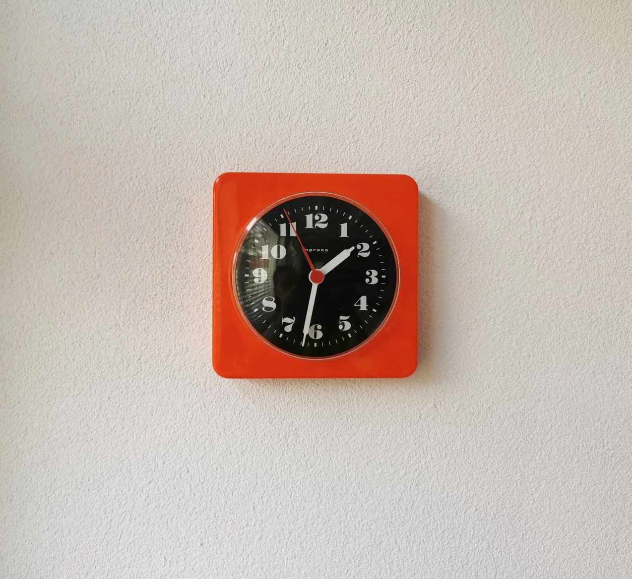 Vintage orange wall clock made of Inproco plastic, 1970