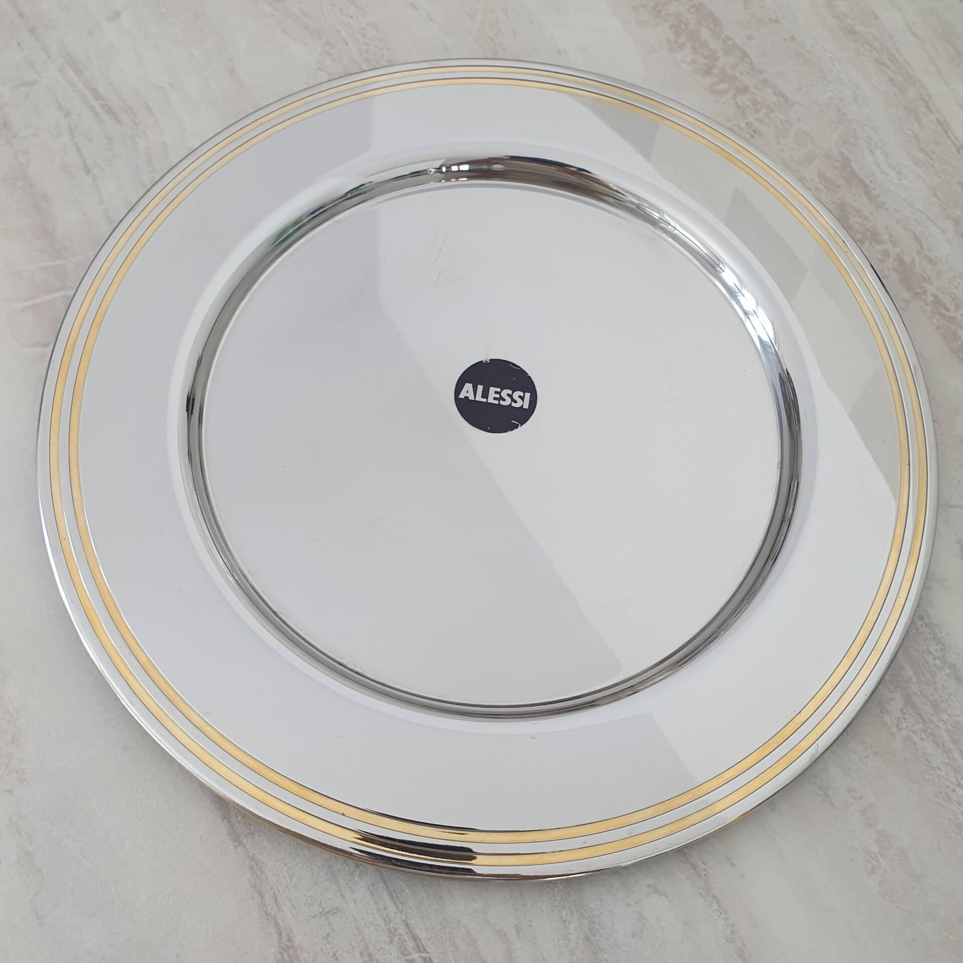 Alessi Ettore Sottsass / Assiette de service inox 18/10 et doré NG5100