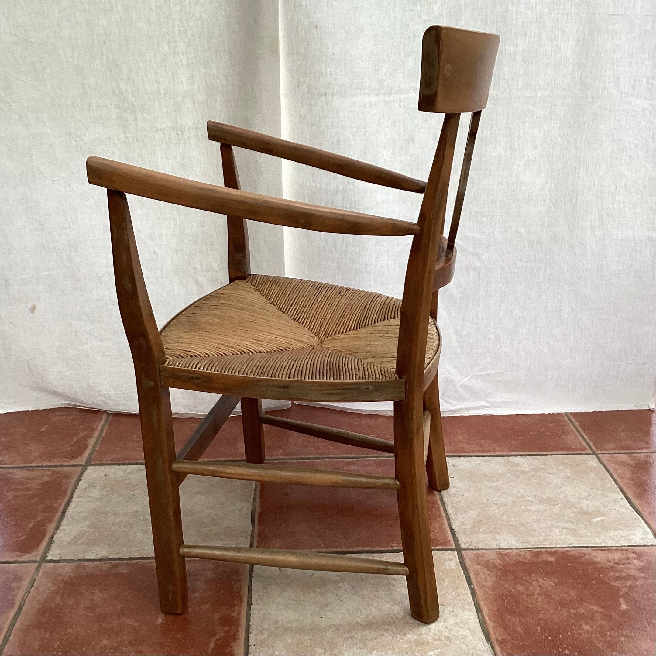Light wood armchair seated in vintage straw dimension: height -78cm- width -54cm-