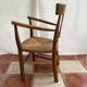 Light wood armchair seated in vintage straw dimension: height -78cm- width -54cm-