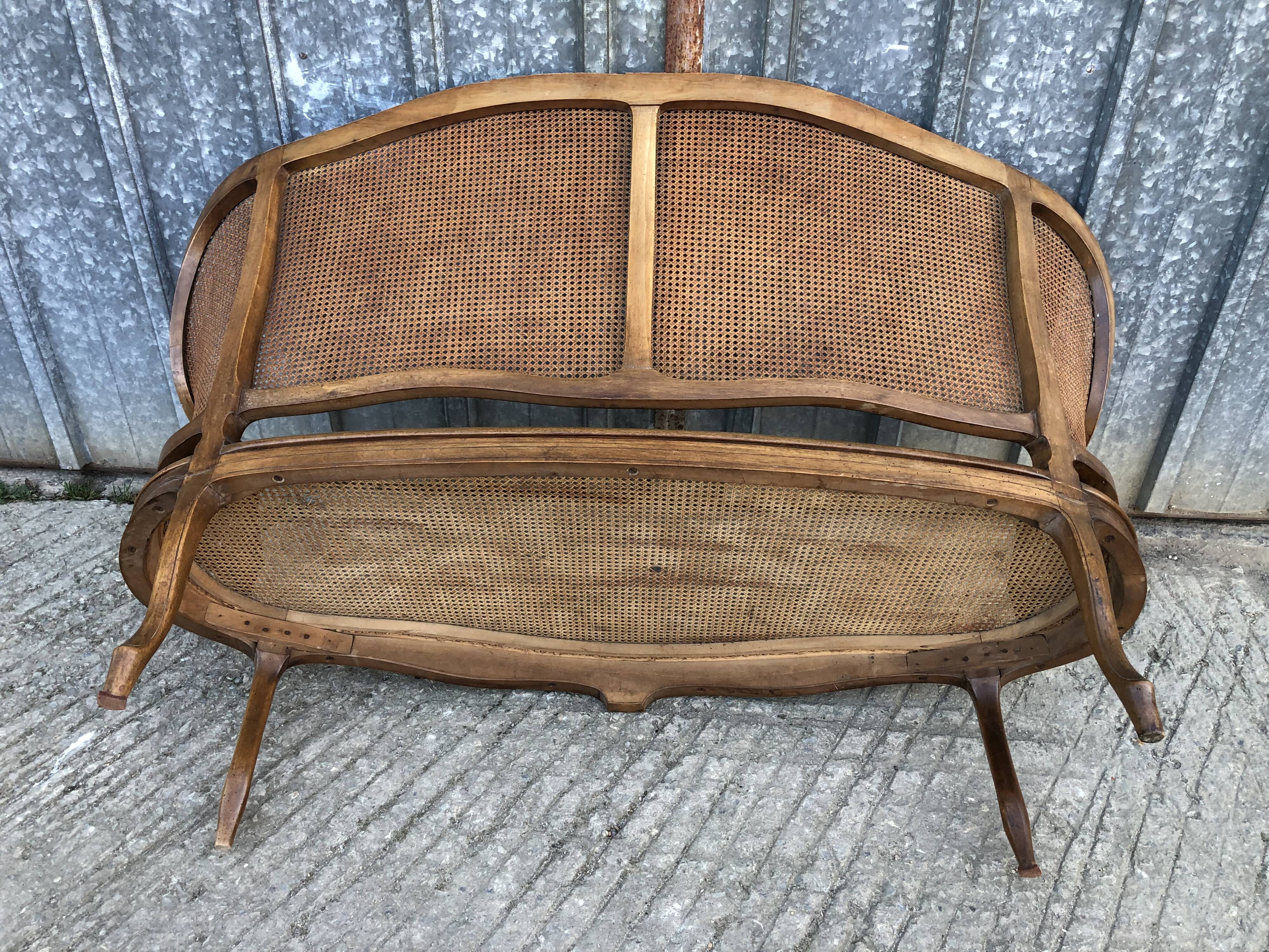 Antique Louis XV bench in solid walnut and caning