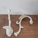 Hooks , bronze coat racks , white