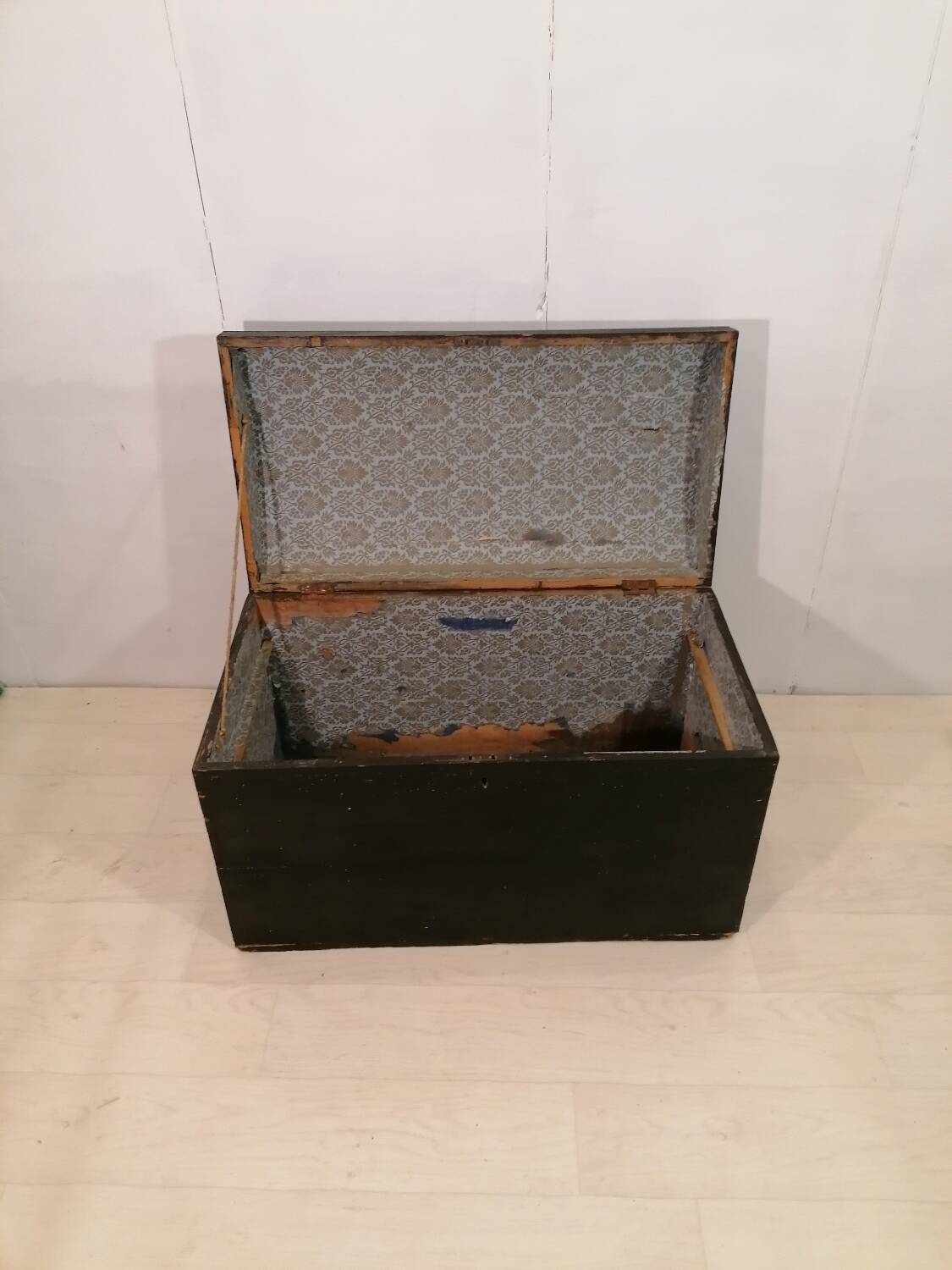 Large travel trunk in blackened wood