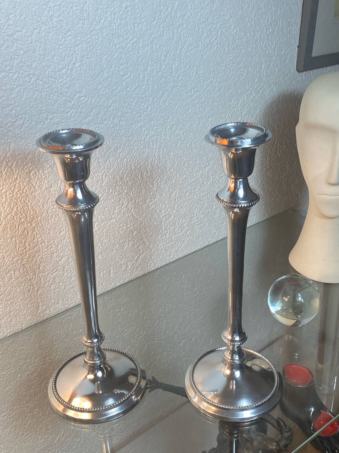 Pair of silver-plated metal candlesticks