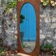 Miroir oval biseauté sur porte art déco Acajou 79x162