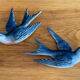 Old pair of porcelain birds for wall decoration.