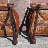 Pair of oak armchairs with straw seats and backs.