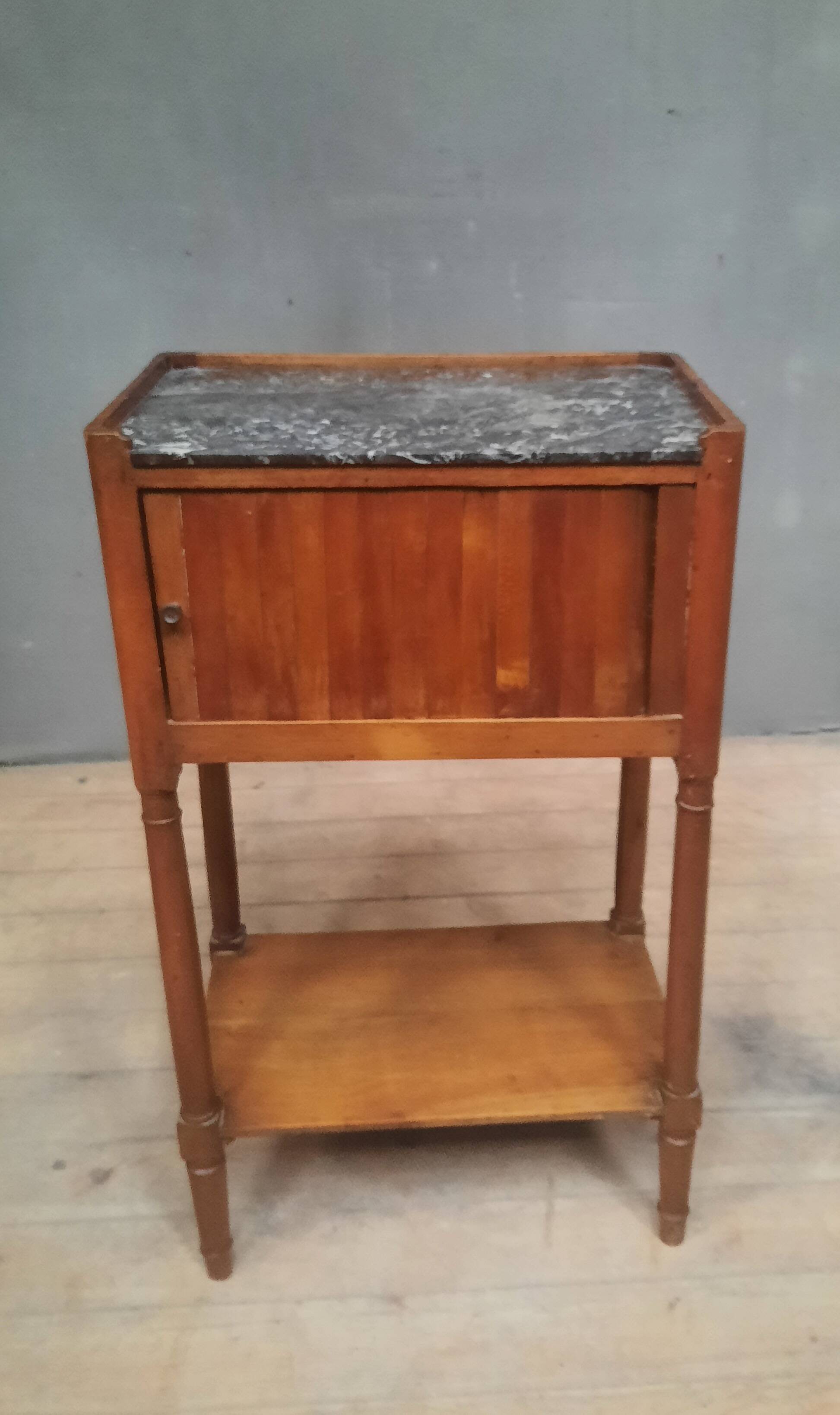 Curtained bedside table from the nineteenth century.