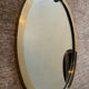 Vintage oval mirror in solid brass