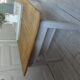 Coffee table made from an authentic farmhouse table, leg patinated pearl gray