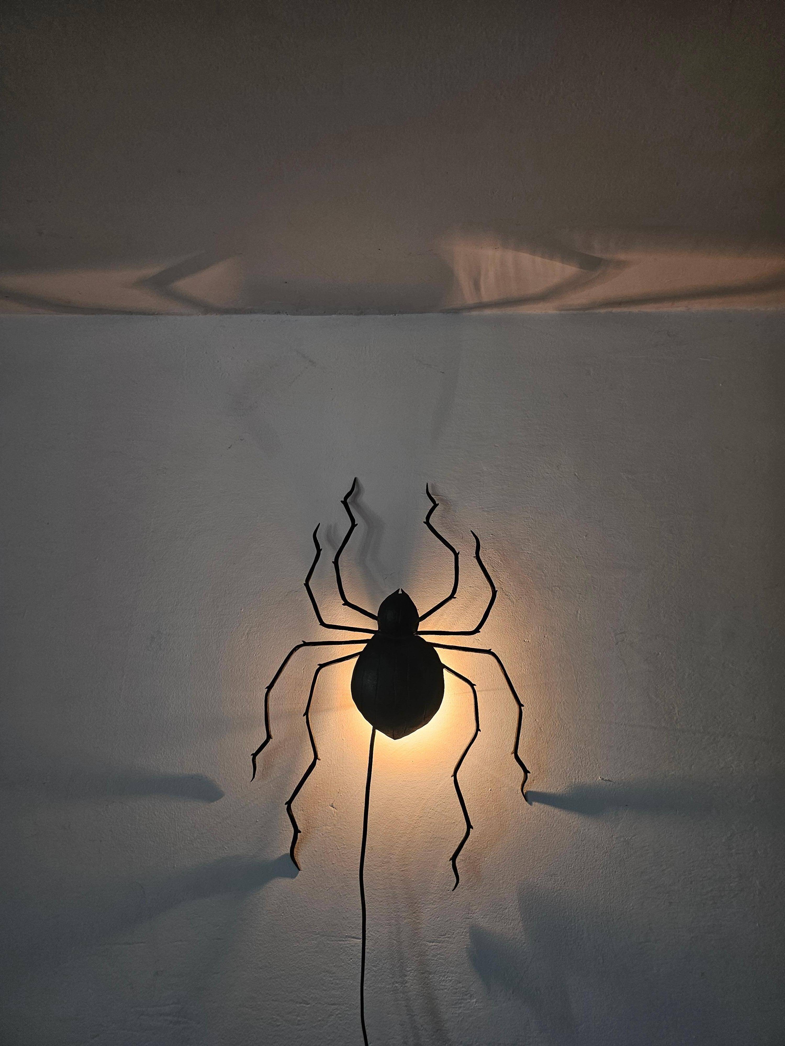 Wall lamp in iron Mid Century Modern spider style from the 1960s.