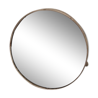 Round rocking mirror on metal stand