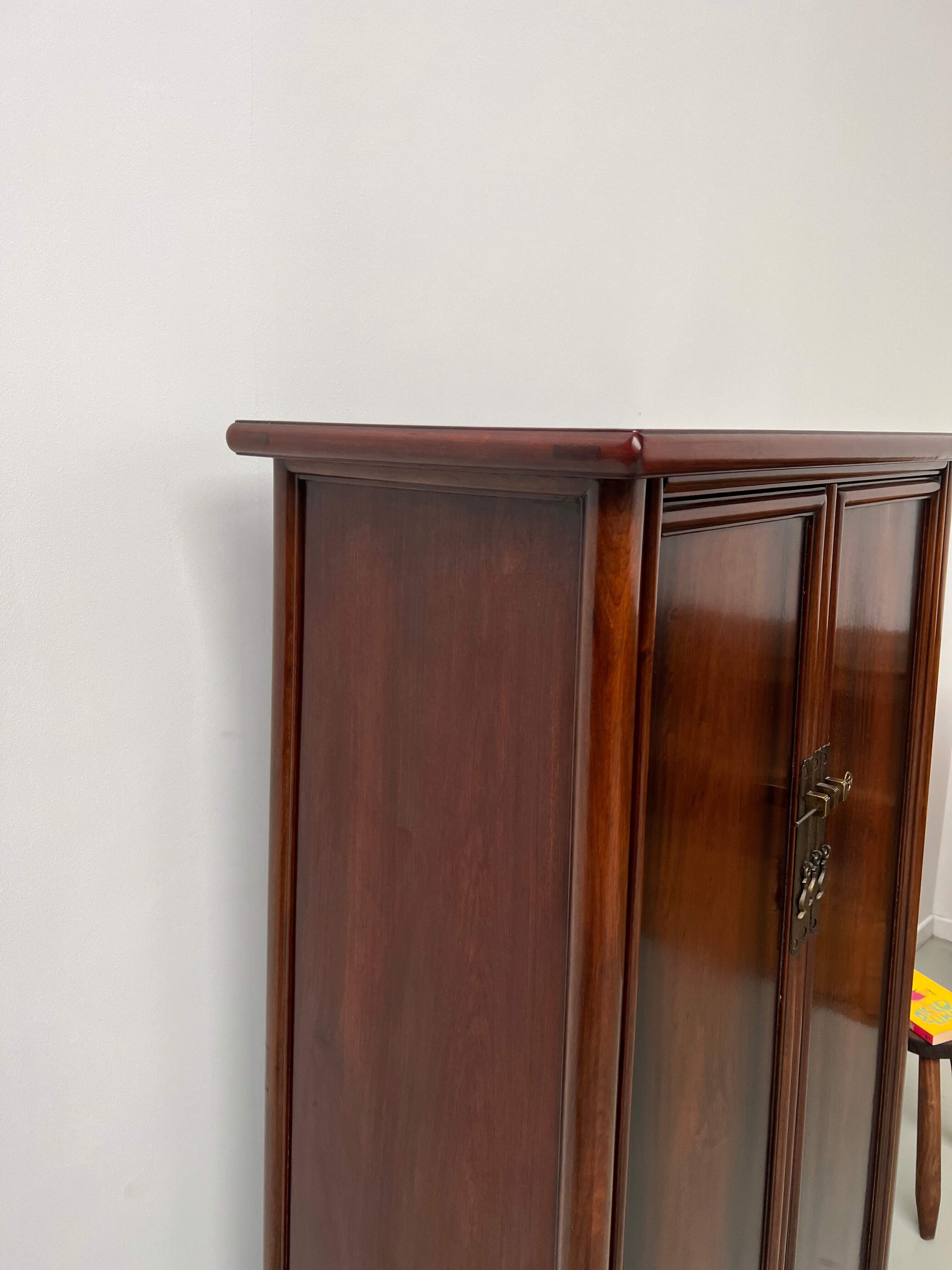 Chinese trapezoidal roller cabinet, made of rosewood.