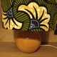 Solid wood ball lamp, lampshade with stylised wax flowers in khaki/yellow.