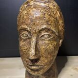 Brutalist head in varnished plaster