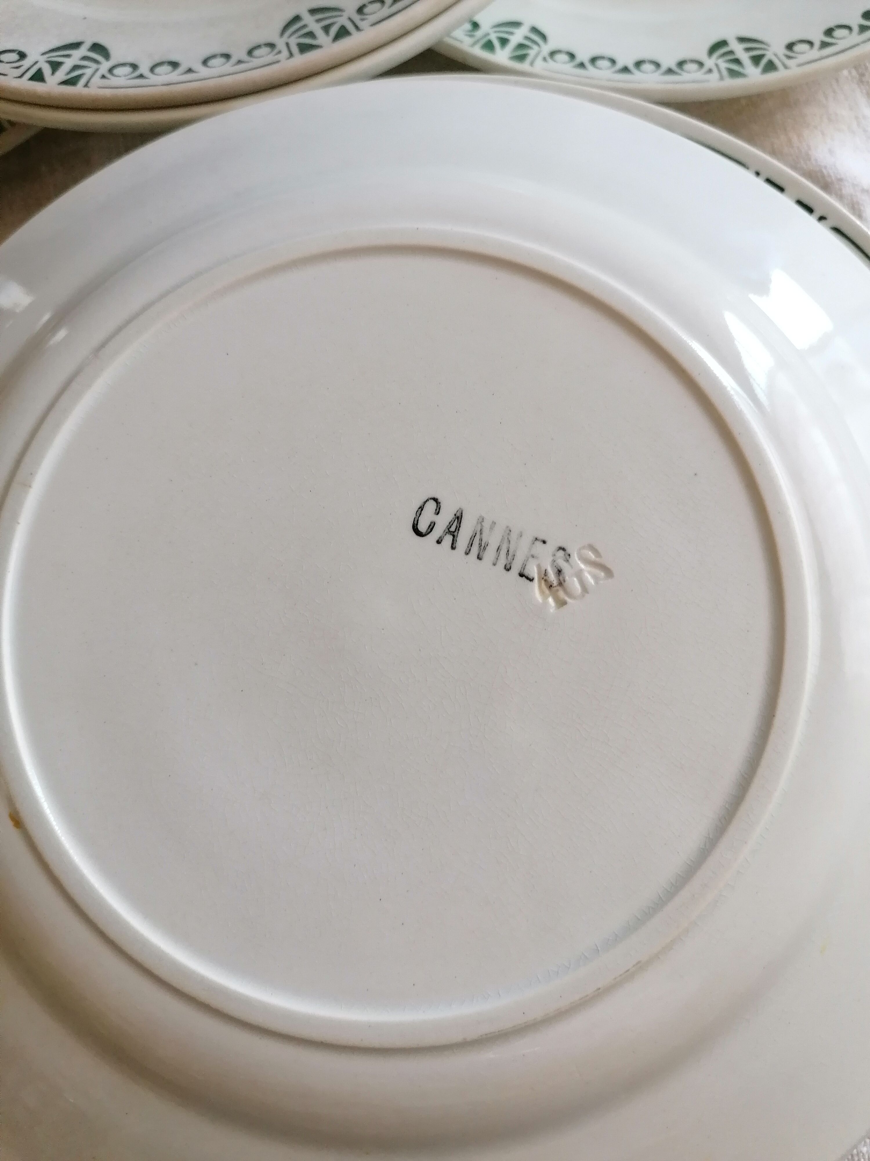 Set of 11 flat earthenware plates